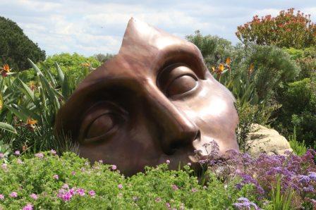 Art face mask in flower garden
